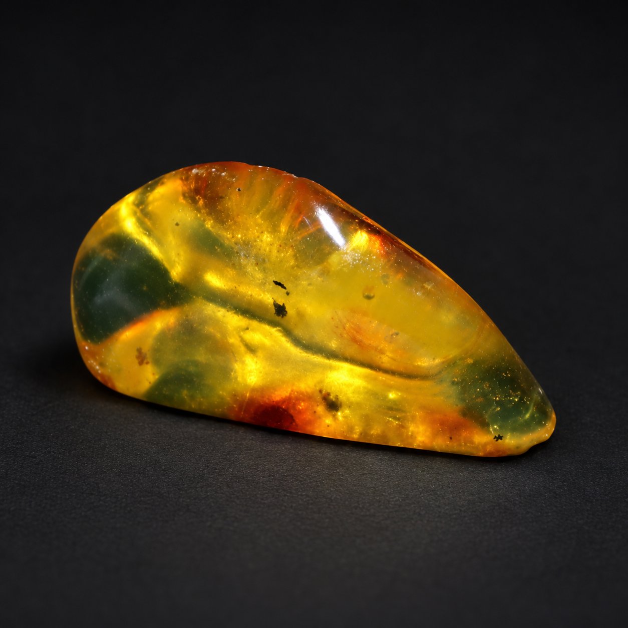 Real orange green polished Dominican amber 39mm